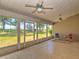 Enclosed tiled patio with ceiling fans provides an outdoor living space at 5410 Nw 62Nd Ave, Ocala, FL 34482