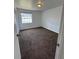 Cozy bedroom with plush carpet, neutral walls and a window for natural light at 5525 Se 43Rd Ct, Ocala, FL 34480