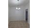 Dining room with tile floors, chair rail, and decorative chandelier at 5525 Se 43Rd Ct, Ocala, FL 34480