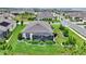 Aerial view of a well-maintained home with a screened lanai and manicured backyard at 5634 Sw 91St Ave, Ocala, FL 34481