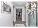 Inviting entryway with neutral walls, stylish mirror, and an elegant wreath on the front door at 5634 Sw 91St Ave, Ocala, FL 34481
