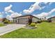 Attractive home with a well-kept lawn and tasteful landscaping, enhancing its curb appeal at 5634 Sw 91St Ave, Ocala, FL 34481