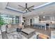 Open-concept living space connecting a modern kitchen with a comfortable living room area at 5634 Sw 91St Ave, Ocala, FL 34481