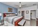Comfortable main bedroom features a window, ceiling fan, and ample space at 5634 Sw 91St Ave, Ocala, FL 34481