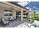 Spacious outdoor patio featuring comfortable seating, ceiling fans, and a relaxing atmosphere at 5634 Sw 91St Ave, Ocala, FL 34481