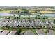 Stunning aerial view of single-Gathering homes near a lake and golf course in a well-maintained community at 5728 Sw 90Th Court Rd, Ocala, FL 34481