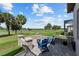 Charming backyard featuring a stone fire pit and seating area, perfect for outdoor entertaining at 5728 Sw 90Th Court Rd, Ocala, FL 34481