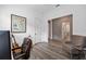 Study with hardwood floors, guitar and armchair at 5728 Sw 90Th Court Rd, Ocala, FL 34481