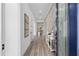 Inviting foyer features stylish wood floors, elegant wall accents, and a view into the spacious living areas at 5728 Sw 90Th Court Rd, Ocala, FL 34481