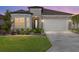 Charming single-story home boasts stone accents, a well-manicured lawn, and a two-car garage with beautiful pavers at 5728 Sw 90Th Court Rd, Ocala, FL 34481