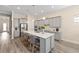 Modern kitchen with stainless steel appliances, a large island, and barstool seating at 5728 Sw 90Th Court Rd, Ocala, FL 34481