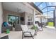 Extended lanai features seating and dining areas, and a view at 5728 Sw 90Th Court Rd, Ocala, FL 34481