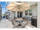 Enclosed Lanai features a dining area, seating area, a storage box, and a grill at 5728 Sw 90Th Court Rd, Ocala, FL 34481