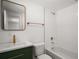 This bathroom offers modern fixtures, including a sleek vanity, and a tiled shower/tub at 719 Nw 8Th St, Ocala, FL 34475