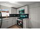 This contemporary kitchen includes stainless steel appliances, light gray cabinets, and granite countertops at 719 Nw 8Th St, Ocala, FL 34475
