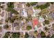 This is an aerial view of a single-Gathering home featuring a boat and a spacious backyard with mature trees at 8 Juniper Pass Way, Ocala, FL 34480