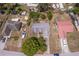 An aerial view shows the property lines of this single-Gathering home, with surrounding neighborhood and mature foliage at 8 Juniper Pass Way, Ocala, FL 34480