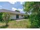 Modest backyard with a concrete patio and grassy area, ready to be transformed into your private outdoor retreat at 8 Juniper Pass Way, Ocala, FL 34480