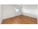 This is a bright bedroom featuring beautiful hardwood floors and a window at 8710 Sw 91St Pl # B, Ocala, FL 34481