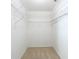 Walk-in closet with metal shelving, carpeted floor, and white walls at 8710 Sw 91St Pl # B, Ocala, FL 34481