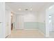 Neutral living room with tile floors, wainscoting, closet, and access to the outside at 8710 Sw 91St Pl # B, Ocala, FL 34481