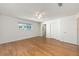Spacious primary bedroom featuring hardwood floors, a ceiling fan, and closet at 8710 Sw 91St Pl # B, Ocala, FL 34481