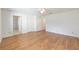 Open main bedroom with hardwood floors, multiple closets, and an en-suite bathroom at 8710 Sw 91St Pl # B, Ocala, FL 34481
