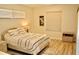 Comfortable bedroom featuring a dresser, soft natural lighting, and inviting interior decor at 8735 Sw 192Nd Court Rd, Dunnellon, FL 34432