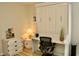 Bedroom featuring Murphy bed, desk, arched window, side table, and wood-look floors at 8735 Sw 192Nd Court Rd, Dunnellon, FL 34432