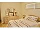 Comfortable bedroom featuring a dresser, soft natural lighting, and inviting interior decor at 8735 Sw 192Nd Court Rd, Dunnellon, FL 34432
