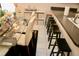 Bright dining room with glass table, chairs, and counter seating at 8735 Sw 192Nd Court Rd, Dunnellon, FL 34432