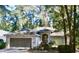 Charming single-story home featuring a well-maintained yard, attached garage, and inviting entrance at 8735 Sw 192Nd Court Rd, Dunnellon, FL 34432