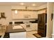 Functional kitchen with ample counter space, white appliances, and a convenient layout at 8735 Sw 192Nd Court Rd, Dunnellon, FL 34432