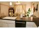 Kitchen area with sink, dishwasher, and adjacent dining area at 8735 Sw 192Nd Court Rd, Dunnellon, FL 34432