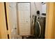 Laundry room with modern washer and dryer units, and a closet with folding doors at 8735 Sw 192Nd Court Rd, Dunnellon, FL 34432