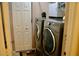 Laundry room featuring modern washer and dryer units, next to a closet, creating a functional space at 8735 Sw 192Nd Court Rd, Dunnellon, FL 34432