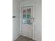 Back door with ring doorbell and 9 pane window at 922 Se 13Th St, Ocala, FL 34471
