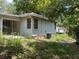 Exterior rear view of a single story home and an overgrown yard at 922 Se 13Th St, Ocala, FL 34471