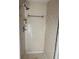 A bathroom shower with beige tiling and shower head at 922 Se 13Th St, Ocala, FL 34471