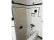 A bathroom showcasing white tiled walls and a bathtub with black trim at 922 Se 13Th St, Ocala, FL 34471