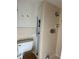 A bathroom with a shower, toilet and built in storage shelves at 922 Se 13Th St, Ocala, FL 34471