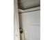 Interior of a closet with shelving and rod for hanging clothing at 922 Se 13Th St, Ocala, FL 34471