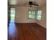 Hardwood flooring featured in a living room with natural light at 922 Se 13Th St, Ocala, FL 34471