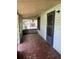 Covered porch featuring painted trim and floor and a screen door at 922 Se 13Th St, Ocala, FL 34471