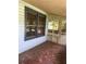 Exterior view of screened front porch featuring painted floor and trim at 922 Se 13Th St, Ocala, FL 34471