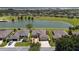 Aerial view showcases the home and the lakefront golf community at 9511 Sw 71St Loop, Ocala, FL 34481