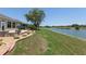 The backyard offers direct access to the lakefront with mature landscaping at 9511 Sw 71St Loop, Ocala, FL 34481