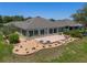 A beautiful brick patio with decorative stone retaining wall and well maintained landscaping at 9511 Sw 71St Loop, Ocala, FL 34481