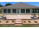 A beautiful brick patio with decorative stone retaining wall and well maintained landscaping at 9511 Sw 71St Loop, Ocala, FL 34481
