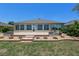 A beautiful brick patio with decorative stone retaining wall and well maintained landscaping at 9511 Sw 71St Loop, Ocala, FL 34481